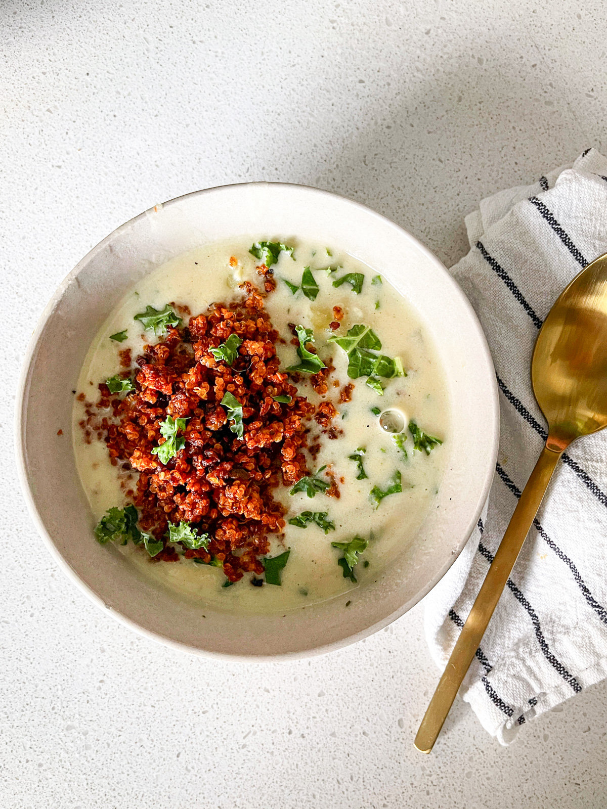 creamy vegan potato and kale soup with smoky quinoa