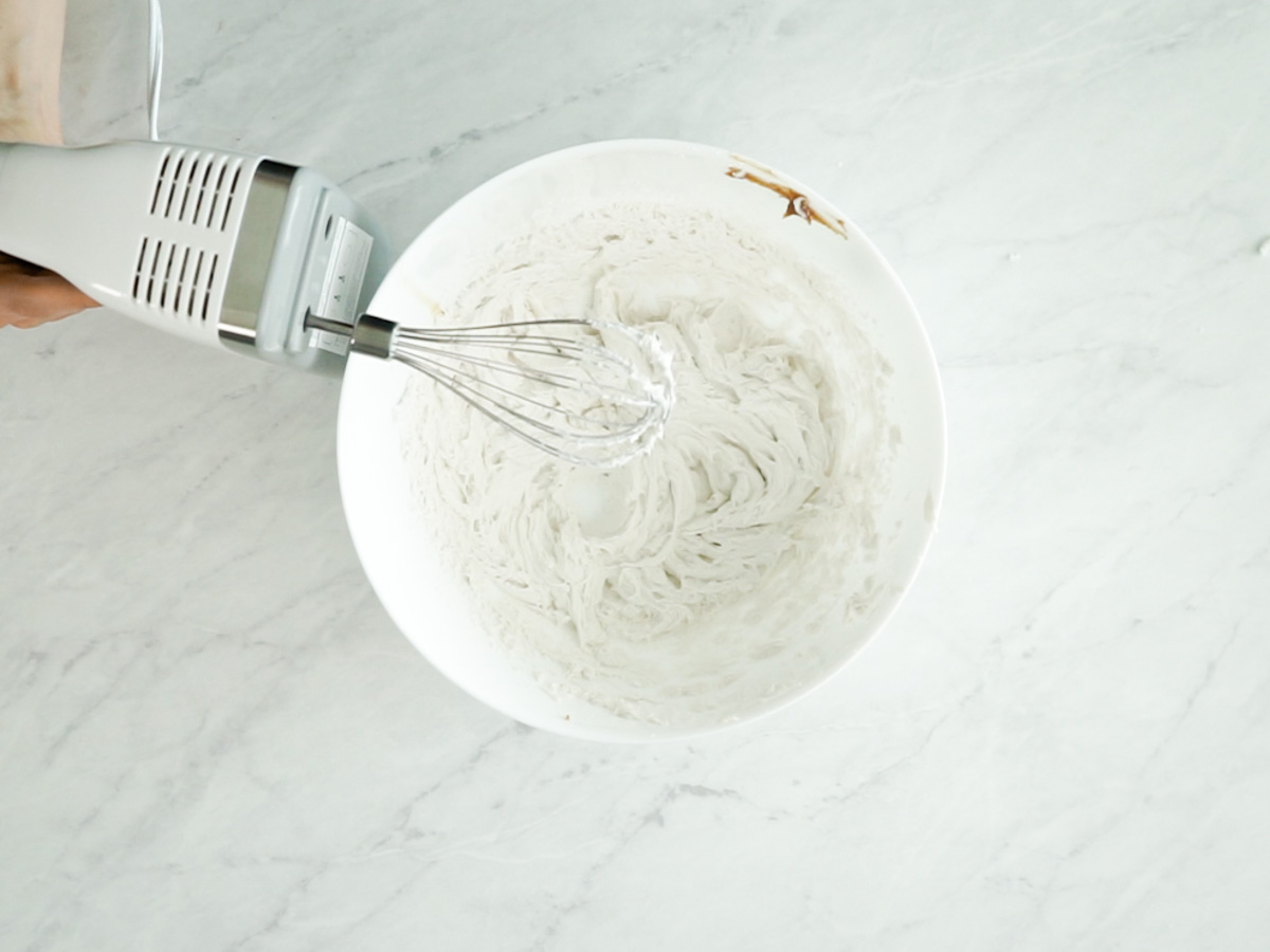 Use a hand mixer to whip the coconut cream.